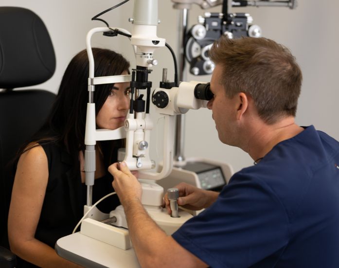 Dr. Gorscak performing an eye exam on a patient in Palm Beach County FL