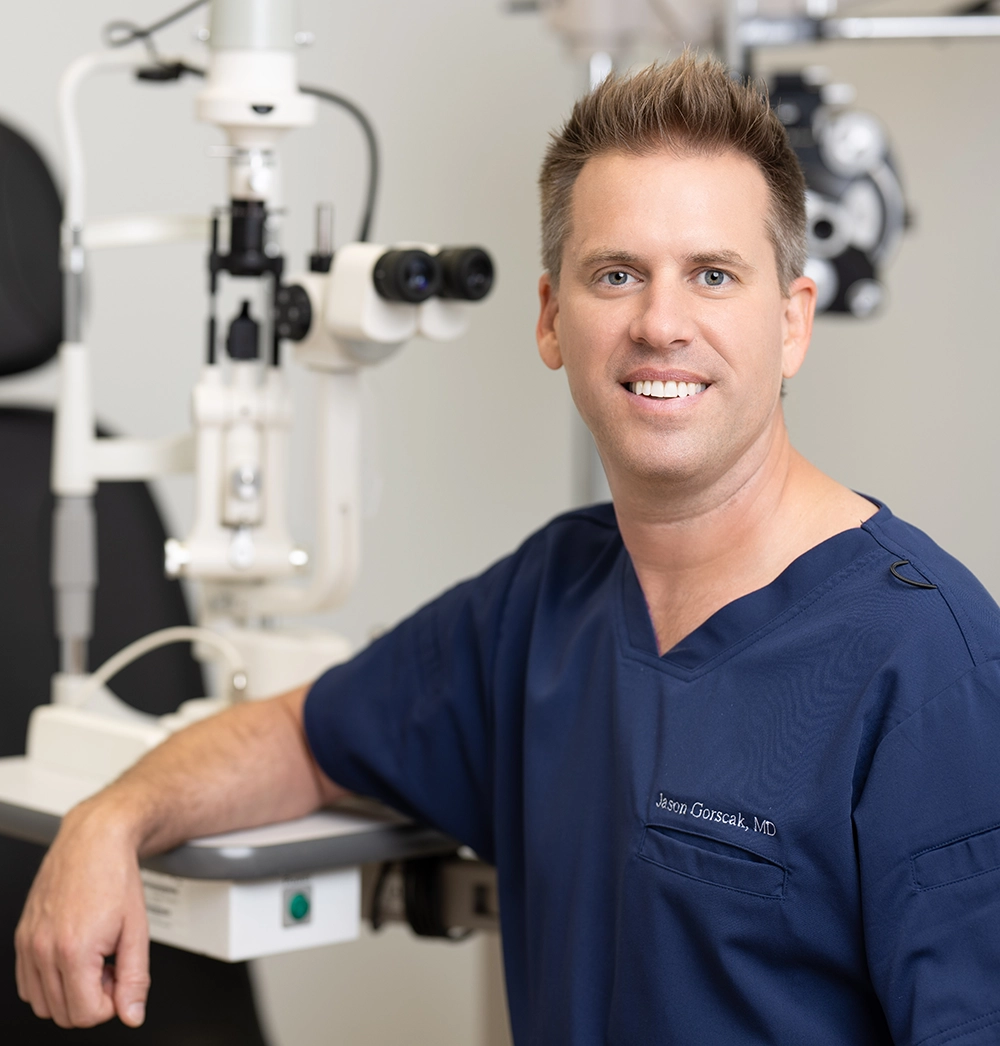 Dr. Jason Gorscak with ophthalmology equipment for cataract surgery evaluation in Palm Beach County FL